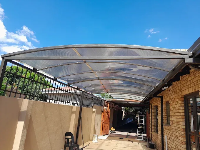 Curved steel carport with polycarbonate roof, Hammanskraal